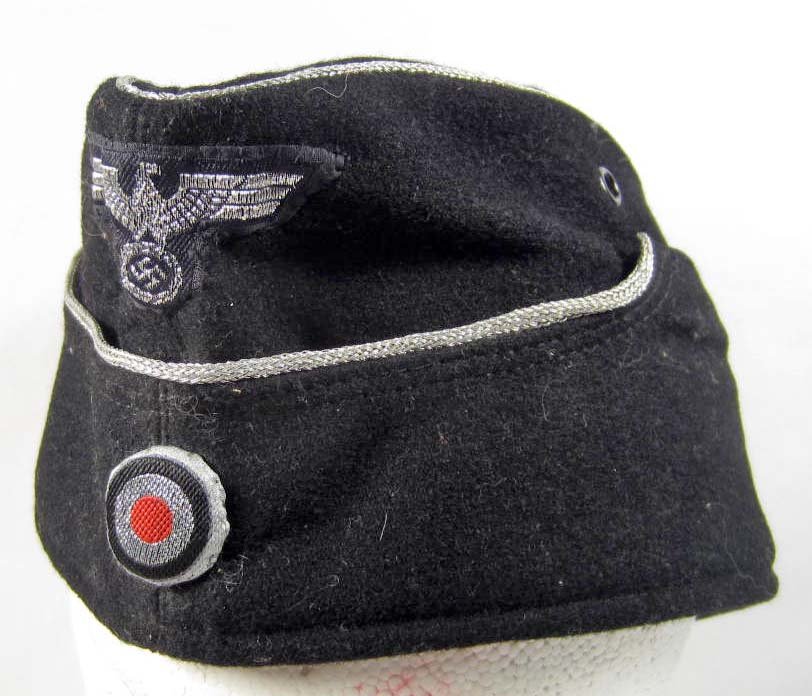 RARE GERMAN NAZI ARMY PANZER OFFICERS OVERSEAS CAP: Has flat silver bullion wire eagle and cockade sewn on the front. Has silver bullion wire piping. The inside is maker marked Robert Lubstein Berlin no 55 1940 58. Black wool construction w/ a grey cot