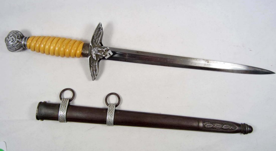 GERMAN NAZI LUFTWAFFE 2ND MODEL OFFICERS DAGGER W/: Approx 16 15/16" long overall. The steel blade is maker marked Alcoso Solingen and also has their weights and measures logo w/ ACS. The handle is orange celluloid. Fine condition.
