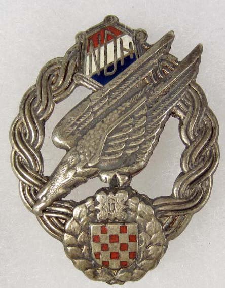 GERMAN NAZI LUFTWAFFE CROATION PARATROOPER FALLSCH: Approx. 1 5/8" by 2 1/16". Has a wide vertical pinback. Stamped nickel construction w/ enamel highlights. Nicely toned.