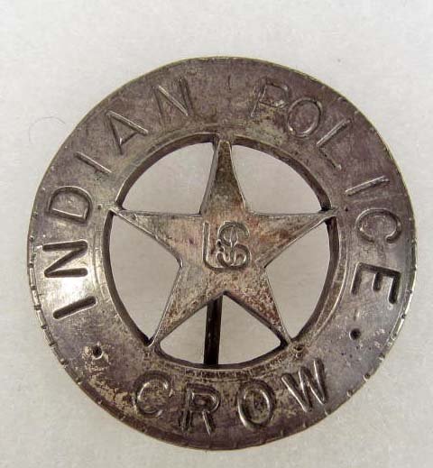 OLD WEST US CROW INDIAN POLICE COWBOY ERA LAW BADG: Approx. 1 13/16" diameter. Pinback. This is a round badge w/ a cut out star in the center. Nickel construction.