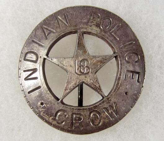 OLD WEST US CROW INDIAN POLICE COWBOY ERA LAW BADG: Approx. 1 13/16" diameter. Pinback. This is a round badge w/ a cut out star in the center. Nickel construction.