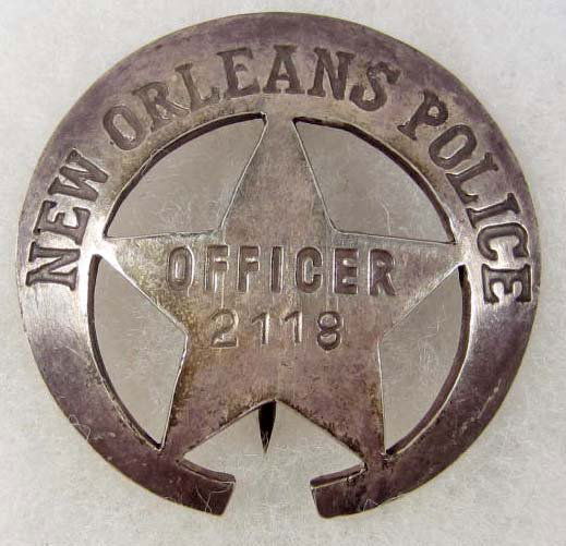 OLD WEST NEW ORLEANS POLICE OFFICER #2118 LAW BADG: Approx. 2 1/8" in diameter. Shows a 3/4 crescent moon w/ a cut out star in the center. Pinback. The reverse side is marked Coin Silver.