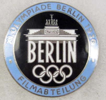 GERMAN NAZI 1936 BERLIN SUMMER OLYMPICS FILM MAKER: Approx. 1 9/16" diameter. Maker marked Rob Neff Berlin 57. Pinback. Nickel and enamel construction.