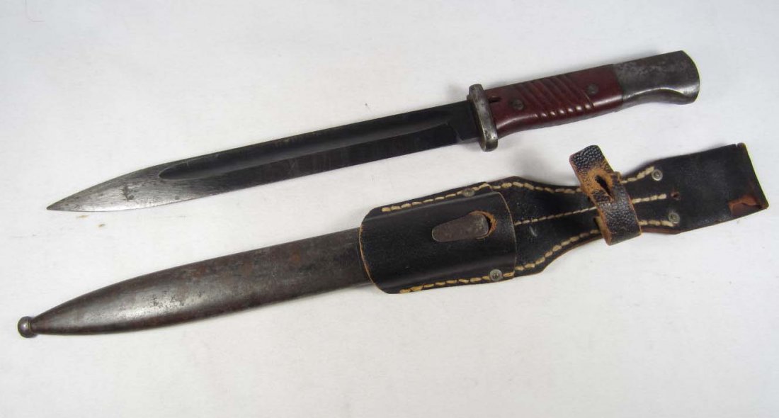 GERMAN NAZI WAFFEN SS MAUSER K-98 RIFLE COMBAT BAYO: Approx. 16" long overall. Has an SS enameled rounded inset into the bakelite handle. Steel blade is marked 43asw 0024 ww. Includes a black leather belt frog that is marked w/ a set of SS runics and RB