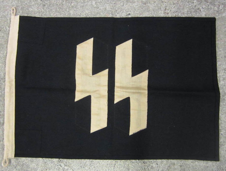 RARE GERMAN NAZI WAFFEN SS RUNIC BATTLE WAR FLAG: Approx. 18.25" by 26.5". Body is black wool construction and the double sided runics are cotton. Has a canvas bunting w/ rope on one end that is marked Lager FL 50 x 70. Machine sewn.
