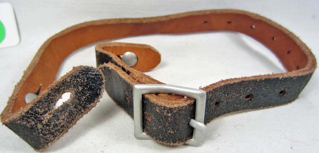 GERMAN NAZI ARMY LUFTWAFFE COMBAT HELMET CHIN STRAP: Approx. 5/8" by 15.5". Maker marked R Larson Berlin 1939. Brown and lack leather w/ an aluminum buckle