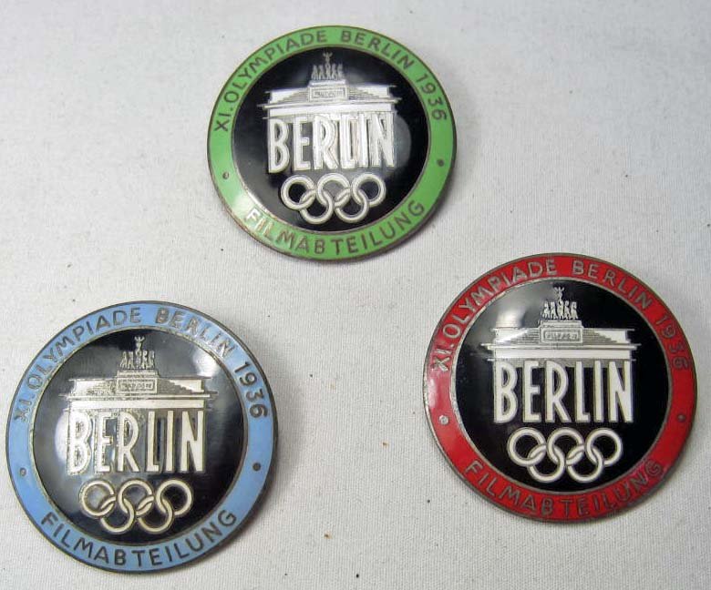 LOT OF 3 GERMAN NAZI BERLIN OLYMPICS FILM MAKER BADGES: Pinback. maker marked Rob Neff Berlin W 57. The are approx. 1.5" diameter. Nickel and enamel