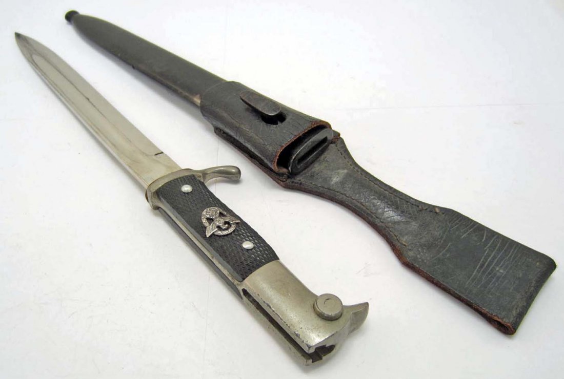GERMAN NAZI POLICE BAYONET W/ SCABBARD: Approx. 15 5/8" long overall. The steel blade is maker marked Anton Wingen Jr Solingen w/ the Knight logo in the center. Approx. 7/8" by 9 9/16". Includes the lack leather belt frog.