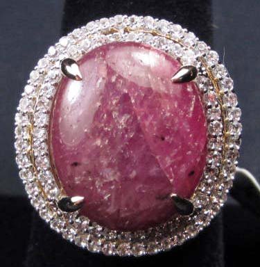STERLING SILVER LADIES STAR RUBY & WHITE SAPPHIRE RING : STERLING SILVER LADIES STAR RUBY & WHITE SAPPHIRE RING - SZ. 7.75 - Comes with AIG Appraisal of $2,425.00. 1 prong set oval natural star ruby center stone. 80 prong set mixed cut white sapphires. Ruby