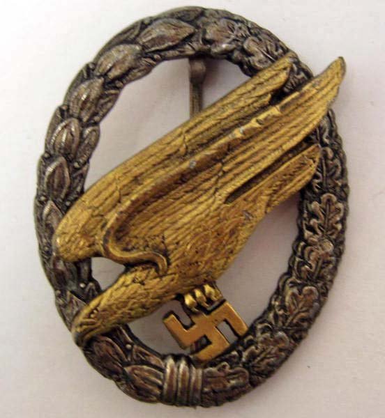 GERMAN LUFTWAFFE PARATROOPER FALLSCHIRMJAGER JUMP BADGE: Pinback. Maker marked Brehmer Berlin 3. Two piece two flat rivet construction.
