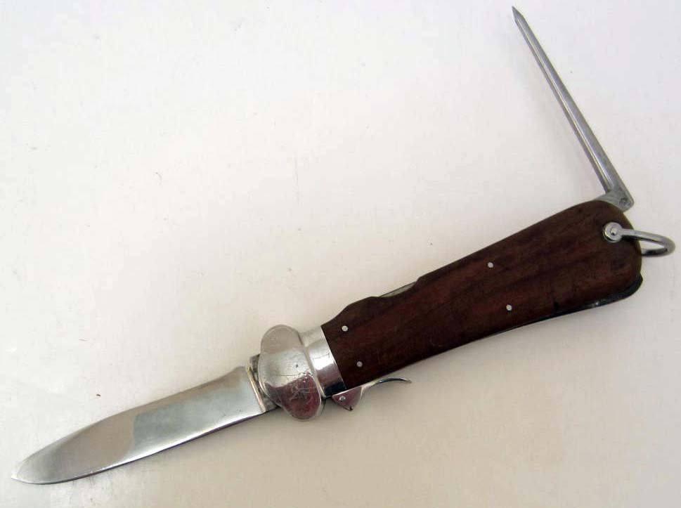 GERMAN NAZI LUFTWAFFE PARATROOPER FALLSCHIRMJAGER GRAVI: Approx. 10 1/8" long overall. The steel blade is approx. 13/16" wide by 4" long. The spike is marked w/ an eagle 5. Has a fine pair of wood grips. From a Veterans estate. Rare.