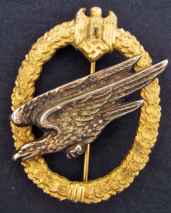 GERMAN NAZI ARMY PARATROOPER FALLSCHIRMJAGER JUMP BADGE: Has a thin vertical pinback. Two piece two flat rivet construction.