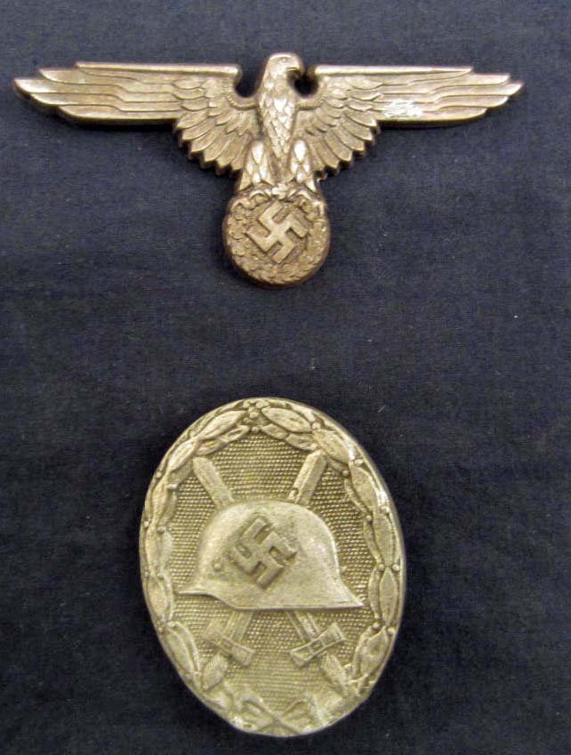 GERMAN NAZI SILVER WOUND BADGE: Pinback. Maker marked 30 Awarded for receiving 3 to 4 wounds. Also included is a Waffen SS Officers Visor Cap Eagle. it is maker marked ES PF. One prong is not present. Stamped nickel construction.