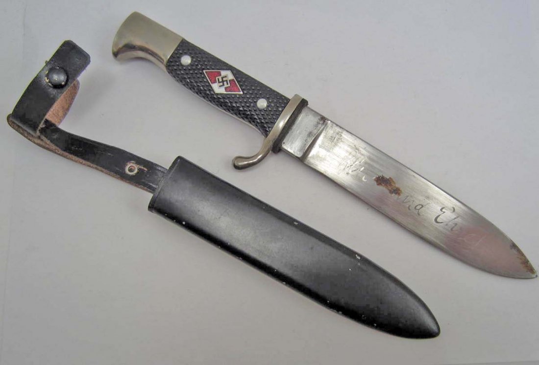GERMAN NAZI HITLER YOUTH HJ UTILITY KNIFE W/ SCABBARD: Approx. 10 1/16" long overall. The steel blade is etched Blut und Ehre! (Blood and Honor!) Approx. 1" by 7/16". Black painted steel scabbard w/ leather belt hanger attached. Nickel handle w/ two black
