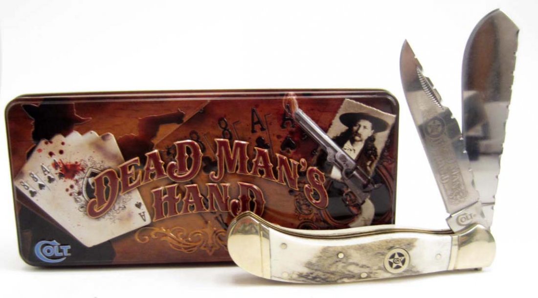 6060 - COLT DEAD MAN'S HAND SADDLEHORN TRAPPER KNIFE IN: History of the 'Dead Man's Hand' - Wild Bill Hickok died when he was shot in the back playing poker at Saloon Number 10 in Deadwood, South Dakota during the gold rush of 1876. Though the identity of t