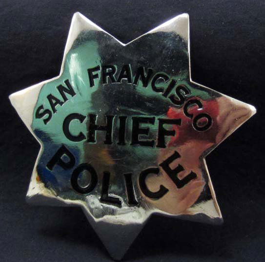 OBSOLETE SAN FRANCISCO POLICE CHIEF LAW BADGE - PINBACK: Approx. 3 1/8" diameter. This is a seven pointed star w/ black enameled letters. Nickel construction.