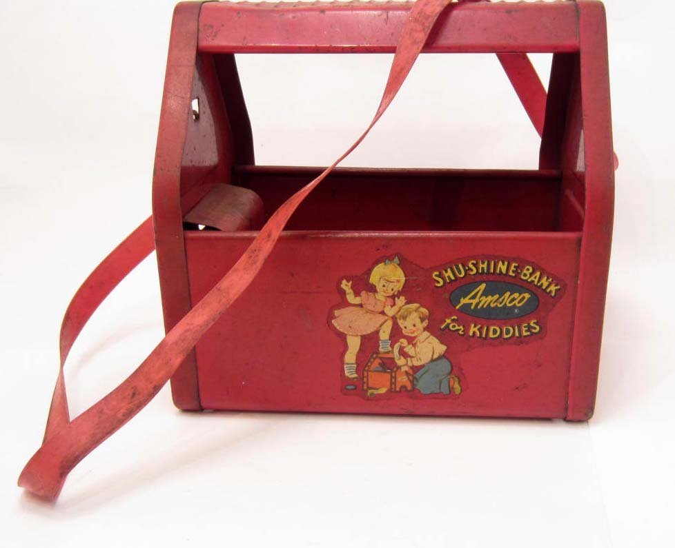 VINTAGE AMSCO TIN SHOE SHINE BANK TOY "FOR KIDDIES" W/: VINTAGE AMSCO TIN SHOE SHINE BANK TOY "FOR KIDDIES" W/ ORIGINAL PLASTIC STRAP - 8.25" x 6" x 8"