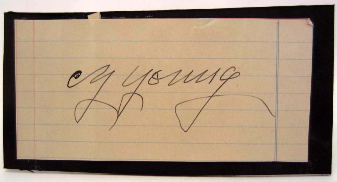 CY YOUNG SIGNATURE ON A CUT PIECE OF PAPER MOUNTED TO: We have not had this autograph authenticated by a professional & while we believe it to be real, it is not guaranteed.