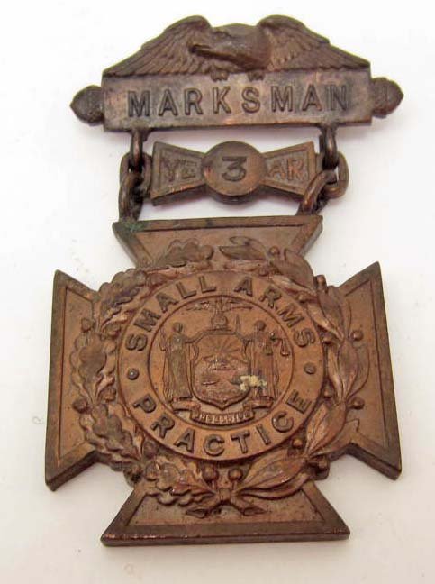 US PRE WW1 ARMY 3RD YEAR MARKSMAN DECORATION: Has a thin horizontal pinback. Front reads Marksman 3rd Year Small Arms Practice. The reverse side is maker marked TIFFANY & Co. Three Piece solid bronze construction. RARE