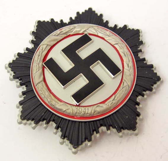 GERMAN NAZI GERMAN CROSS IN SILVER: Has wide vertical pinback that is maker marked 1 for the firm of Deuschler & Sohn Muchen. Multi piece four domed rivet construction w/ a black enameled swastika in the center. Awarded for meritorious 