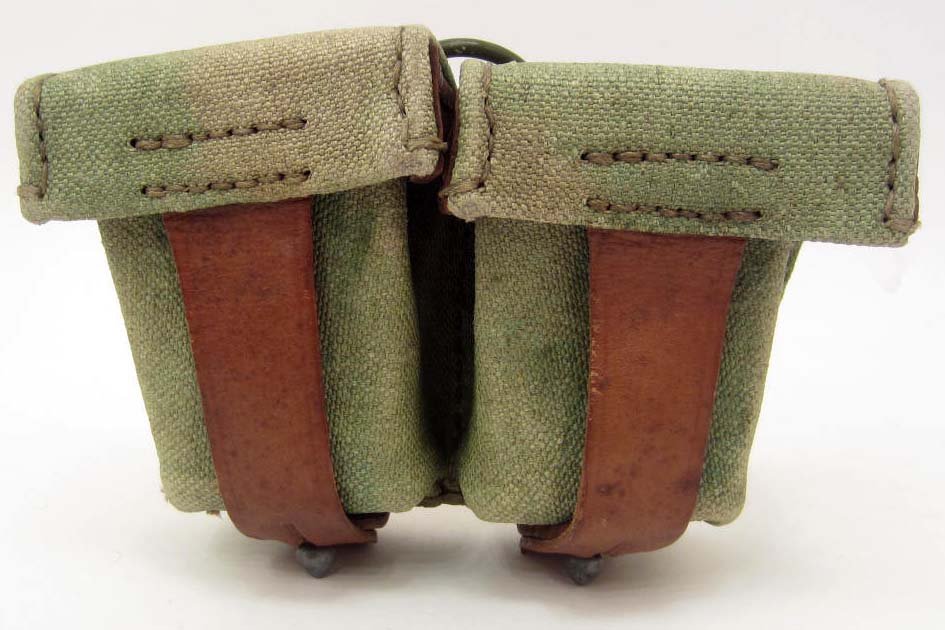 GERMAN NAZI AFRIKA KORPS MAUSER K-98 TROPICAL AMMO: Approx. 4 1/2" by 6 5/8" by 2 1/4". Has a Nazi army eagle waffen ampt stamp on the back of the leather strap. Canvas and leather construction.