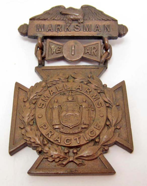 US PRE WW1 ARMY 1ST YEAR MARKSMAN DECORATION: Has a thin horizontal pinback. Front reads Marksman 1st year small arms practice. reverse side is maker marked TIFFANY & Co. Three piece solid construction. Rare.