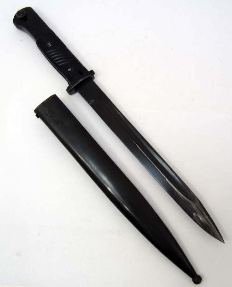 GERMAN NAZI ARMY MAUSER K-98 COMBAT BAYONET W/ SCABBARD: GERMAN NAZI ARMY MAUSER K-98 COMBAT BAYONET W/ SCABBARD. Approx. 16" long overall. Steel blade is marked Erfurt 42. Approx. 15/16" wide by 9 15/16" long. Has a pair of black bakelite grips. Handle and