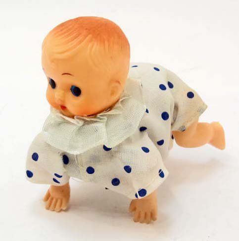 VINTAGE CELLULOID WIND-UP BABY TOY - WORKS: Approx. 4.25" long.