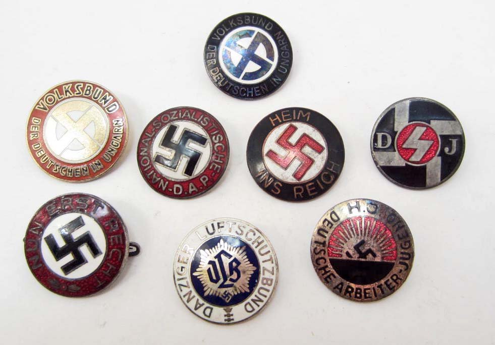 LOT OF 8 GERMAN NAZI ENAMELED PARTY BADGES: Volksbund, HJ Deutsche, Arbeiter Jugend, NSDAP, Danzig Luftshuts RLB, Heim Ins Reich, DJ, Nun Erst Recht, Volksbund Der Deutschen In Ungarn. All have pinbacks. Most are maker marked. Nickel w/ brass a