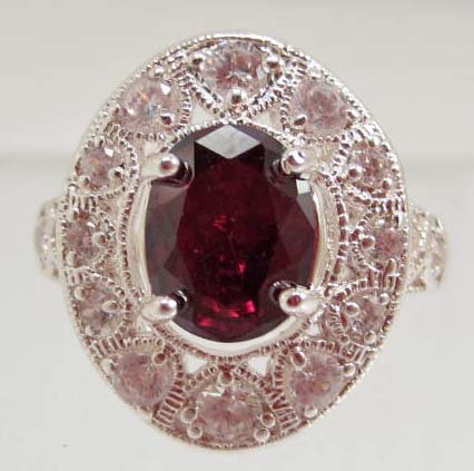 SILVER PRONG SET GARNET LADIES RING