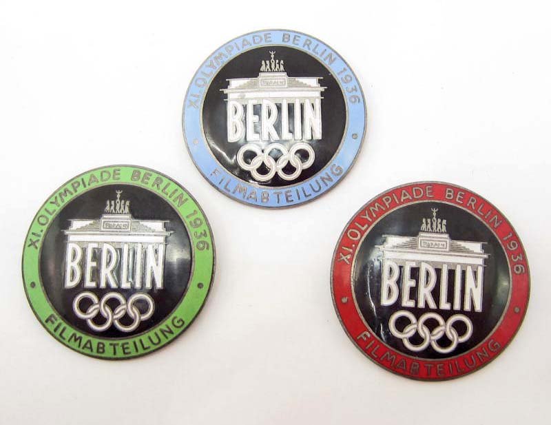 LOT OF 3 GERMAN NAZI BERLIN SUMMER OLYMPICS FILM MAKER: LOT OF 3 GERMAN NAZI BERLIN SUMMER OLYMPICS FILM MAKER BADGES All three have pinbacks. Maker marked Rob Neff Berlin W 57. Nickel construction w/ enamel.