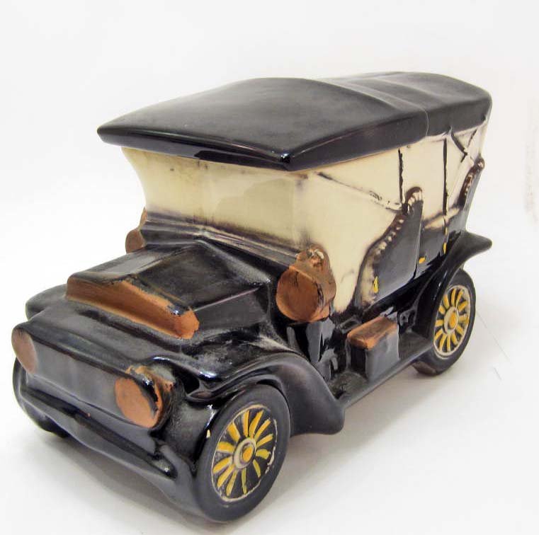 COOKIE JAR - OLD TOURING CAR - MCCOY USA: A marked McCoy USA cookie jar of an old touring car. It measures approximately 6.5" tall and 10" wide.