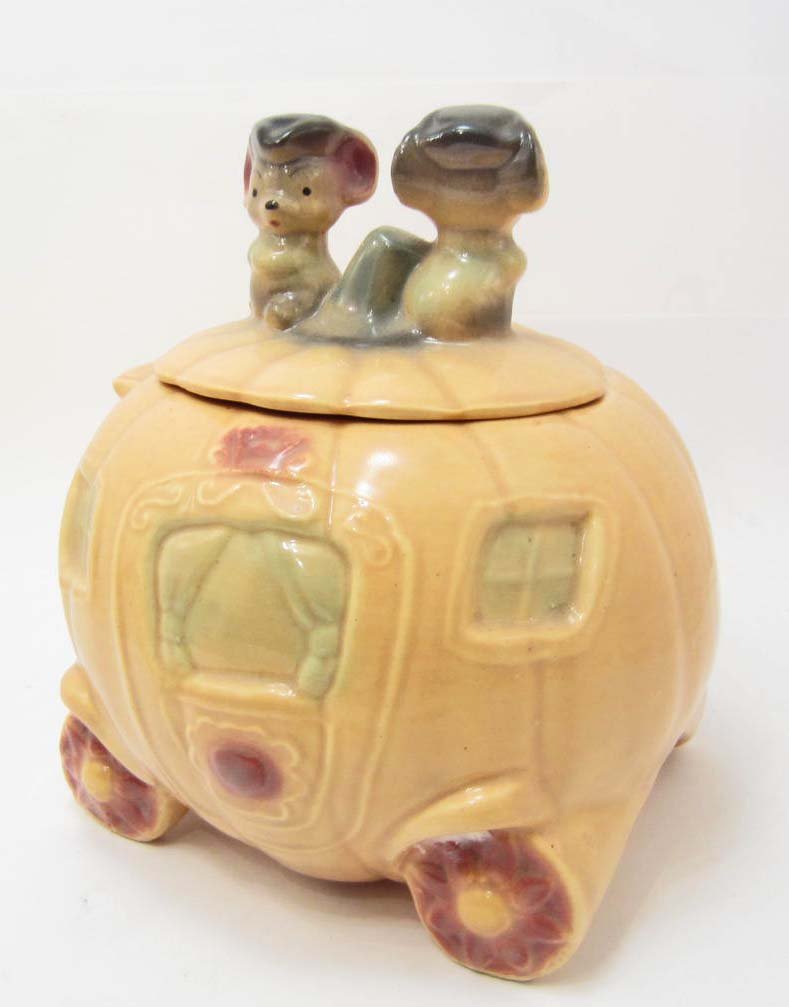 COOKIE JAR - CINDERELLA'S PUMPKIN CARRIAGE - BRUSH USA: A vintage cookie jar manufactured by Brush (Marked W32 Brush USA) of Cinderella's pumpkin carriage. It has sight crazing on the bottom. Measures approximately 10" tall.