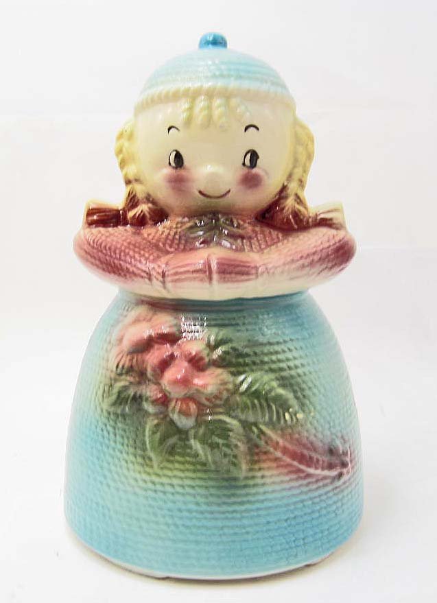 COOKIE JAR - YARN DOLL - AMERICAN BISQUE: A vintage cookie jar of a yarn doll made of bisque and is unmarked. There is slight crazing on the bottom. Measures approximately 11" tall.