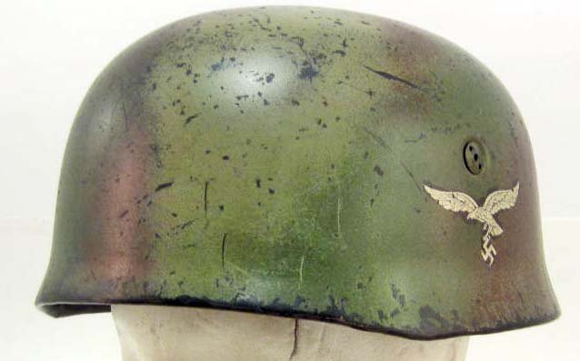 GERMAN NAZI LUFTWAFFE PARATROOPER FALLSCHIRMJAGER: Camouflage. Single decal camo helmet w/ a Normandy pattern paint scheme. The colors include Reds, Greens & Tans. The four helmet bolts are the early three holed spanner type. The interior includes the