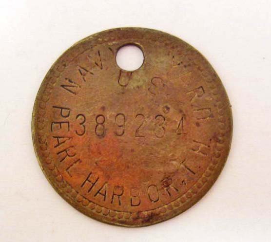 RARE WW2 PEARL HARBOR US NAVY YARD BRASS TAG: Marked on one side NAVY YARD PEARL HARBOR, T.H. 389284. Marked on the other side 14 XII Approx. 1.5" diameter