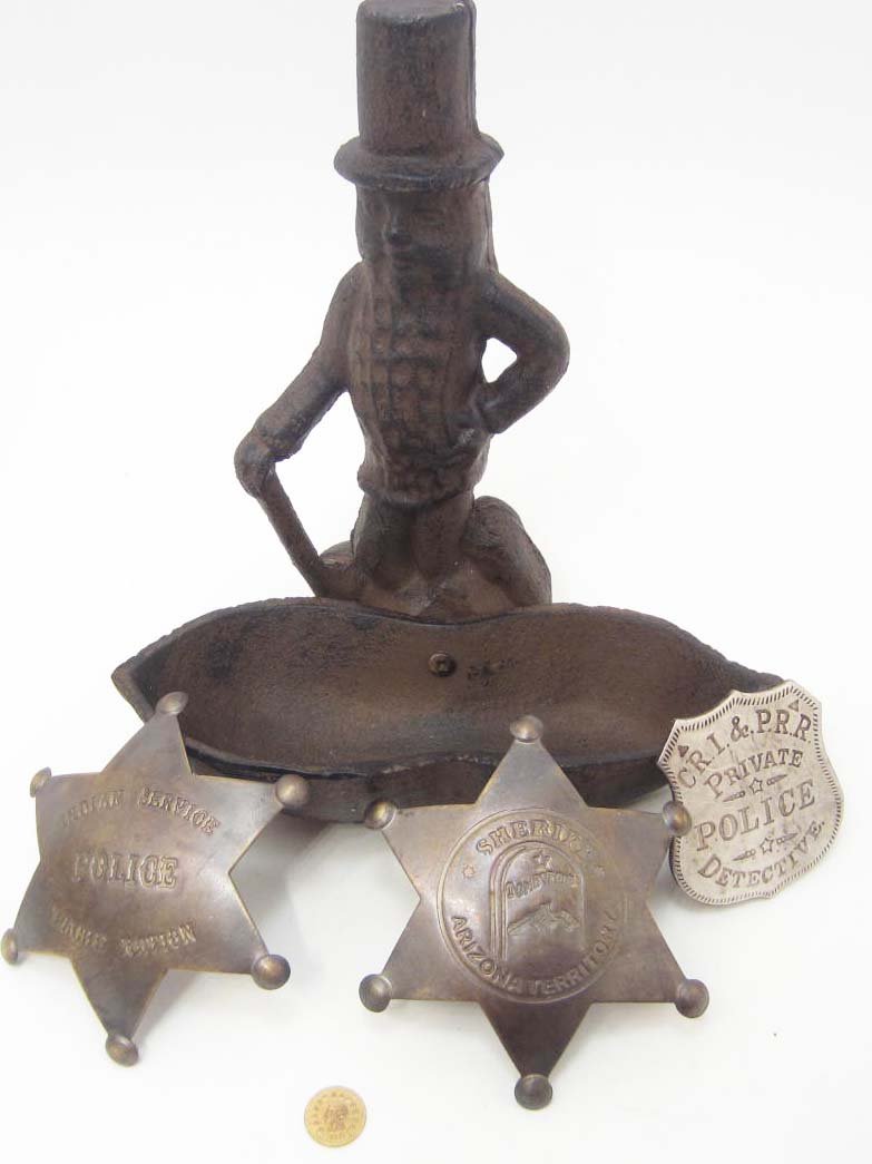 LOT OF MISC. CAST IRON MR. PEANUT & WESTERN BADGES: Cast iron Mr. Peanut stand and tray, C.R.I & P.R.R. Private Police Detective Western collectible badge, Indian Service Police Apache Nation badge, Sheriff Tombstone Arizona Territory badge, California
