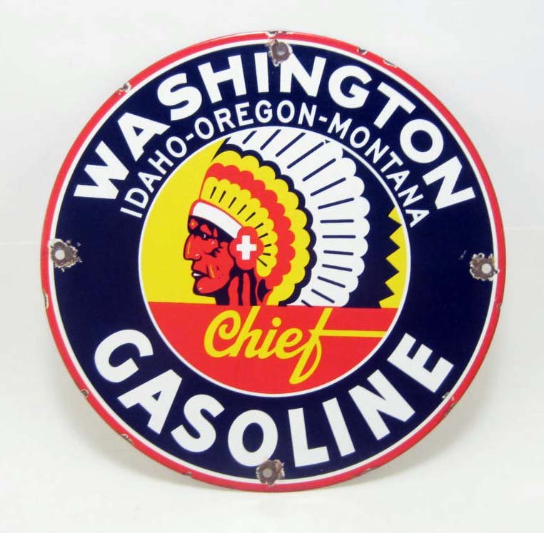 CHIEF GASOLINE PORCELAIN ADVERTISING SIGN: Approx. 11.75" diameter. Front reads Washington Idaho - Oregon - Montana Chief Gasoline. There is an Indian Chief's Head in the center wearing a war bonnet. has smooth porcelain on both sides over met