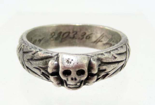 GERMAN NAZI WAFFEN SS OFFICERS HONOR RING: Measures ?" inside diameter. It is engraved on the inside rim S U J Mater 28.03.36 H Himmler. Has a skull on the front with other Germanic symbols around the outer rim. Scarce