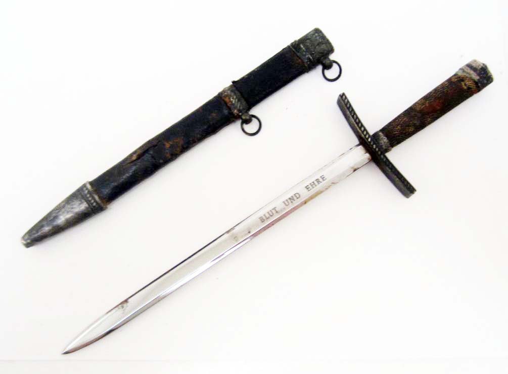 GERMAN NAZI MINIATURE HITLER YOUTH HJ LEADERS DAGGER: With Scabbard. Measures 10" long overall. The front of the etched steel blade reads Blut Und Ehre (Blood And Honor). It measures 7/16" wide by 6 7/8'. The handle is silver wire wrapped and has a nicke