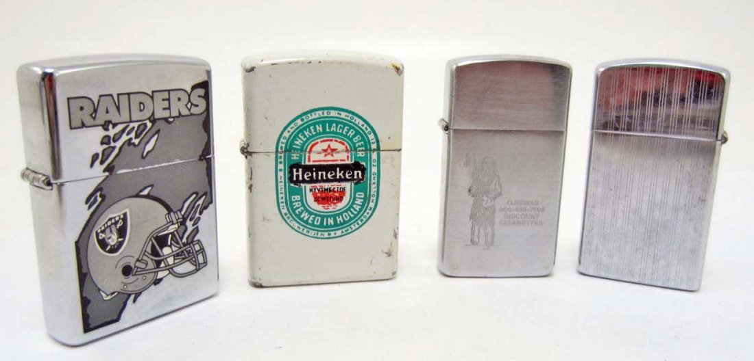 LOT OF 4 VINTAGE ADVERTISING LIGHTERS INCL. ZIPPO: Three silver lighters are marked Zippo on the bottom. The other lighter is white enamel and advertising Heineken and is the only one that is not marked Zippo.