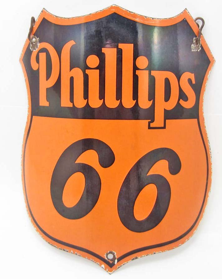 PHILLIPS 66 GASOLINE PORCELAIN ADVERTISING SIGN: Approx. 9 5/8" by 11 3/4". Front reads Phillips 66. It is the shape of a shield. There is an iron hanging chain at the top. Has sooth porcelain over steel on both sides. This type of curved sign was a