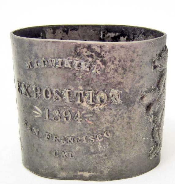 1894 GOLDEN GATE EXPOSITION METAL NAPKIN RING: Approx. 2" diameter by 1.5" tall. Embossed metal.