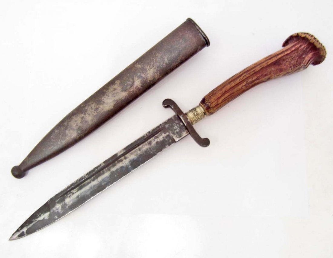 CONFEDERATE CIVIL WAR COMBAT BOWIE KNIFE W/ SCABBARD: Measures 15" long overall. The steel blade is stamped CSA. It measures 1" wide by 7 ¾" long. The steel scabbard measures 1 5/16" wide by 8 15/16" long. Has a nickel pommel with a steel cross guard. T