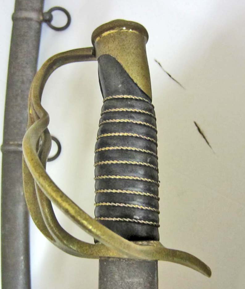 US PRE-CIVIL WAR UNION ARMY MODEL 1840 AMES CAVALRY: AMES HEAVY CAVALRY SWORD W/ SCABBARD. Measures 43 7/8" long overall. The steel blade is maker marked Ames Mfg Co Cabotville 1849 US WD. It measures 1 ¼" wide by 35 ¾" long. The steel scabbard measur