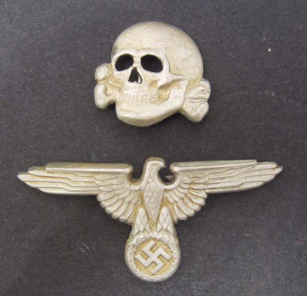 PAIR OF GERMAN NAZI SS HAT BADGES: N/A