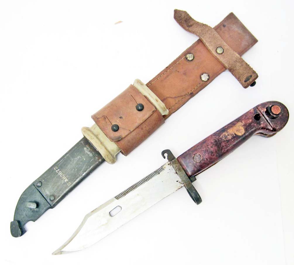 NORTH VIETNAMESE ARMY NVA VIET CONG MACHINE GUNNERS: VC AK 47 Machine Gunners Bayonet & Scabbard. Measures 13 1/8" long overall. The steel blade measures 1 3/16" wide by 6" long. The steel scabbard measures 1 3/8" wide by 8 1/16" long. Both the bayonet 