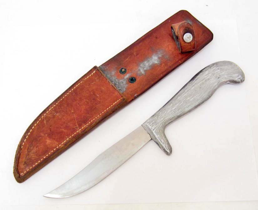 US ARMY MURPHY STYLE COMBAT FIGHTING KNIFE W/ SCABBARD: Measures 10 11/16" long overall. The steel blade measures 15/16" wide by 5" long. The machine sewn brown leather scabbard measures 2 3/8" wide by 10 11/16" long. A scarce side arm.