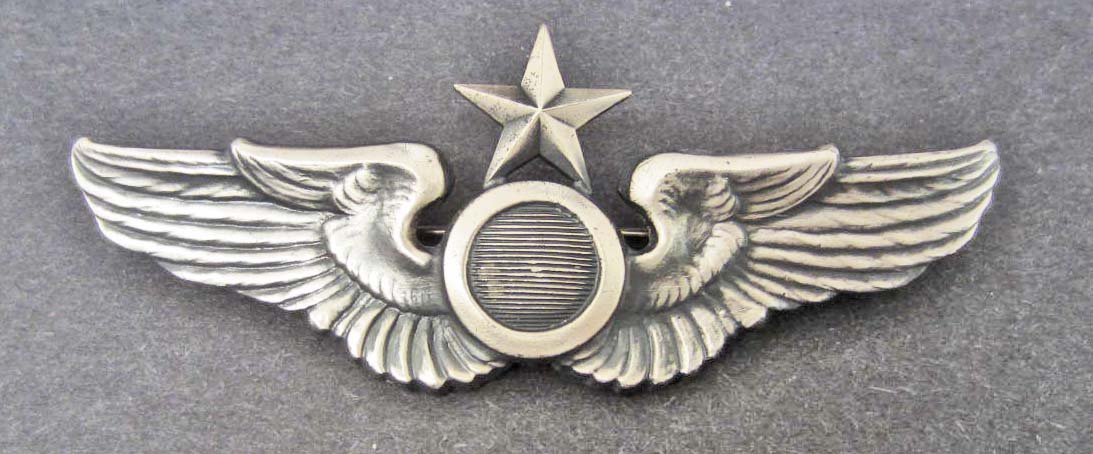 USAAF ARMY AIR FORCE SENIOR OBSERVER WING: Measures 3 3/16" wide by 1 5/16" tall. The reverse is maker marked: NS Meyer New York. Has a thin horizontal pin back with a locking catch. The wing is mounted on an NS Meyer card board card. Two piec
