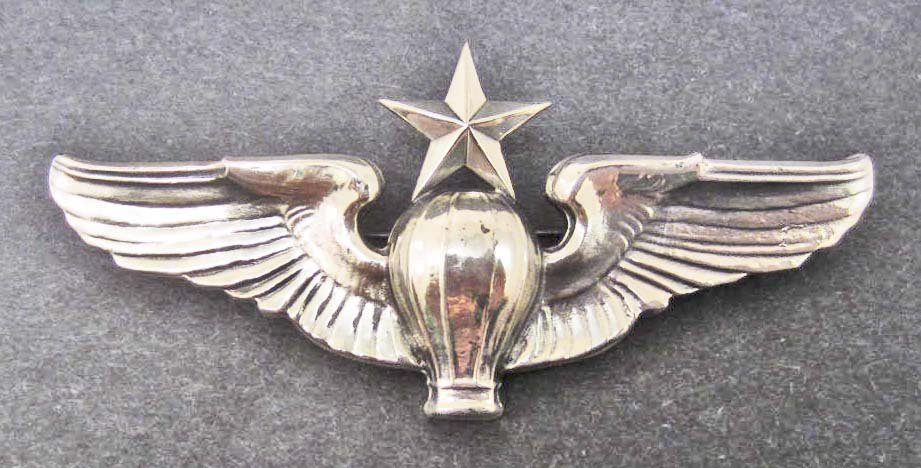 USAAF ARMY AIR CORPS SENIOR BALLOON PILOT WING: Measures 3 3/16" wide by 1 7/16" tall. The reverse is maker marked: NS Meyer New York. Has a thin horizontal pin back with a locking catch. Two piece nickel construction.